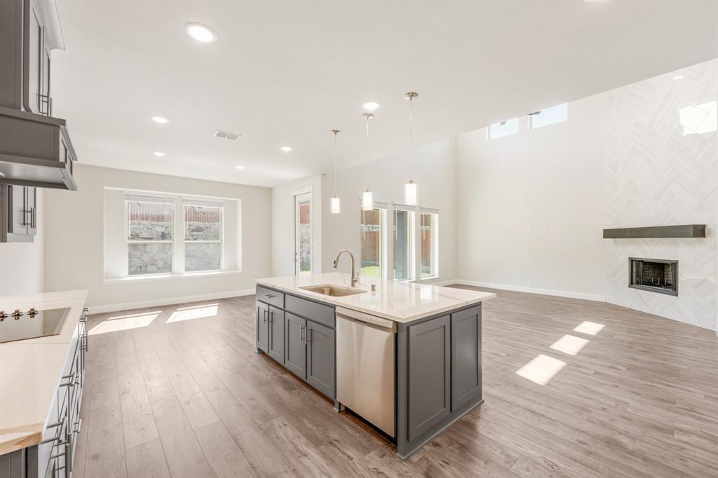 4410 Biscayne Drive Midlothian, TX 76065 - Photo 18 of 40 a large white kitchen with a large window a sink and appliances