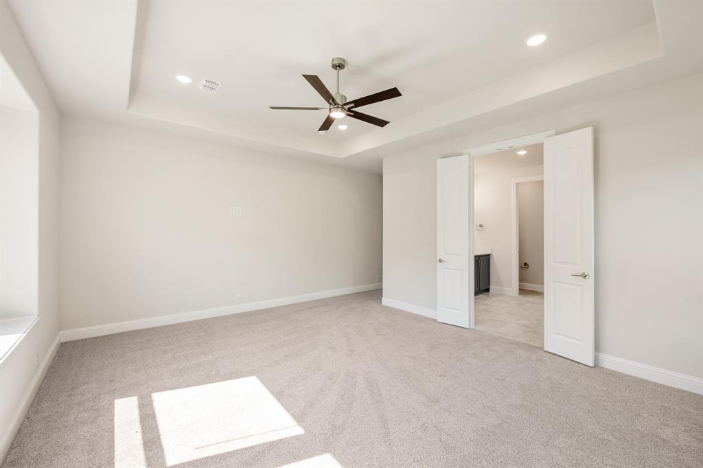 4410 Biscayne Drive Midlothian, TX 76065 - Photo 21 of 40 an empty room with a ceiling fan and a window
