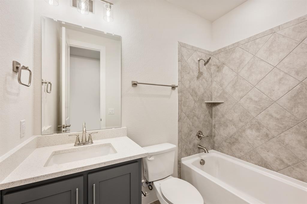4410 Biscayne Drive Midlothian, TX 76065 - Photo 25 of 40 a bathroom with a sink a toilet and shower