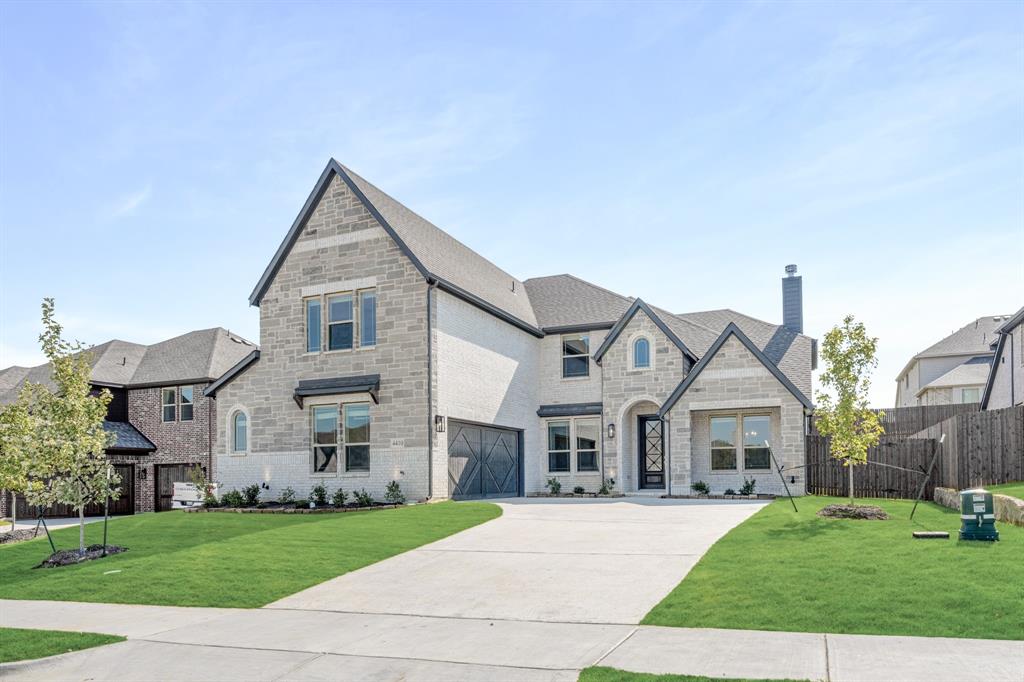 4410 Biscayne Drive Midlothian, TX 76065 - Photo 3 of 40 a front view of a white house with a yard