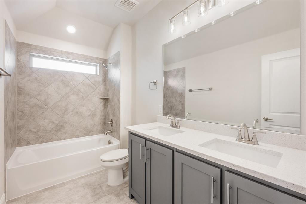 4410 Biscayne Drive Midlothian, TX 76065 - Photo 36 of 40 a bathroom with a sink a toilet and bathtub