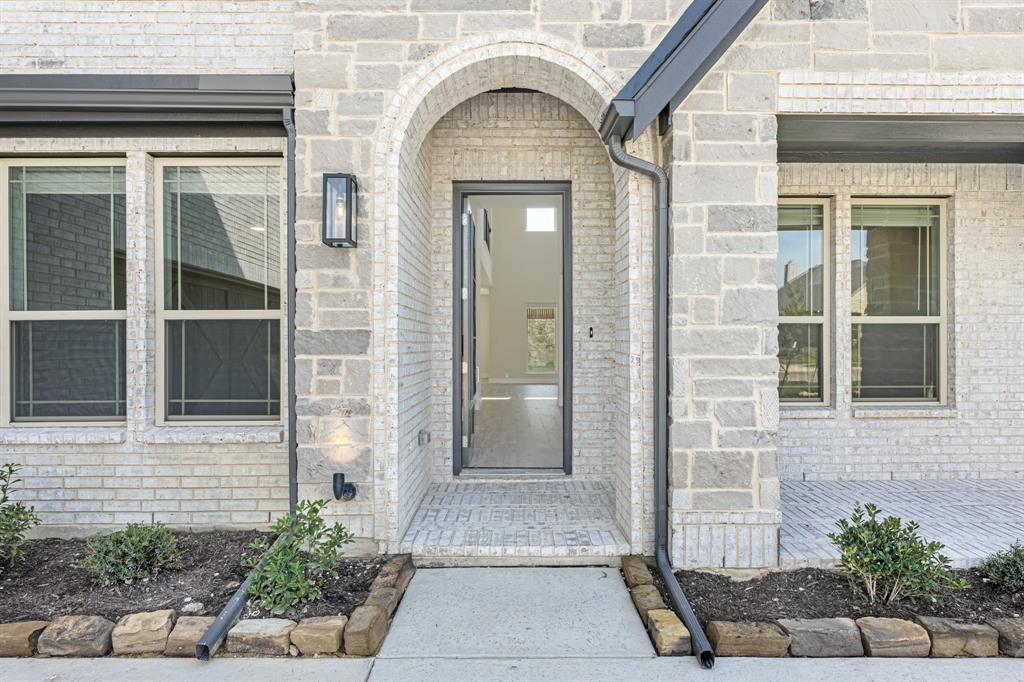 4410 Biscayne Drive Midlothian, TX 76065 - Photo 4 of 40 a view of a brick house with potted plants