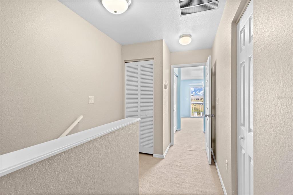 26346 Rampart Boulevard, Unit 904 Punta Gorda, FL 33983 - Photo 17 of 35 a view of hallway with an empty room