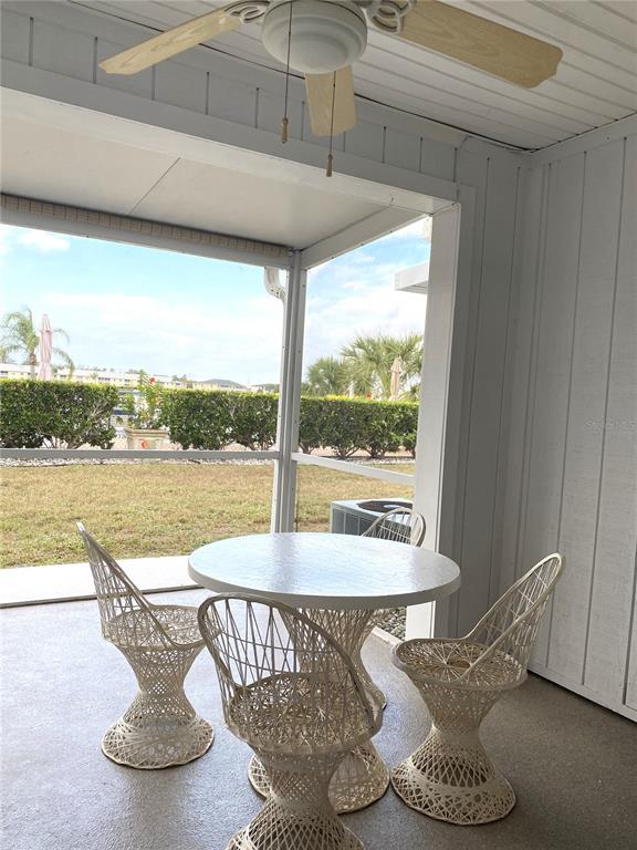 26346 Rampart Boulevard, Unit 904 Punta Gorda, FL 33983 - Photo 22 of 35 a view of a living room with furniture and floor to ceiling window