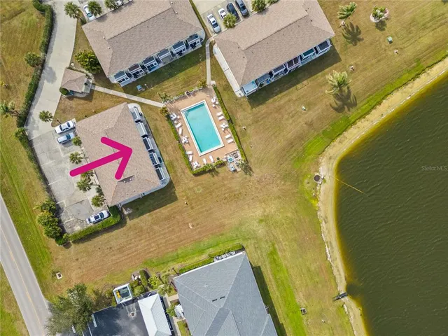 an aerial view of a house with a swimming pool