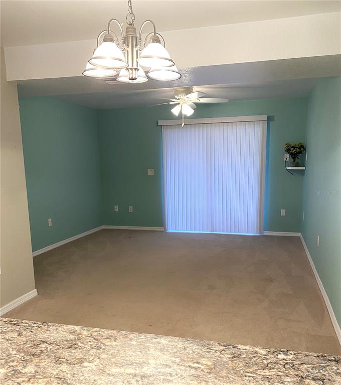 26346 Rampart Boulevard, Unit 904 Punta Gorda, FL 33983 - Photo 32 of 35 a view of wooden floor and chandelier in a room
