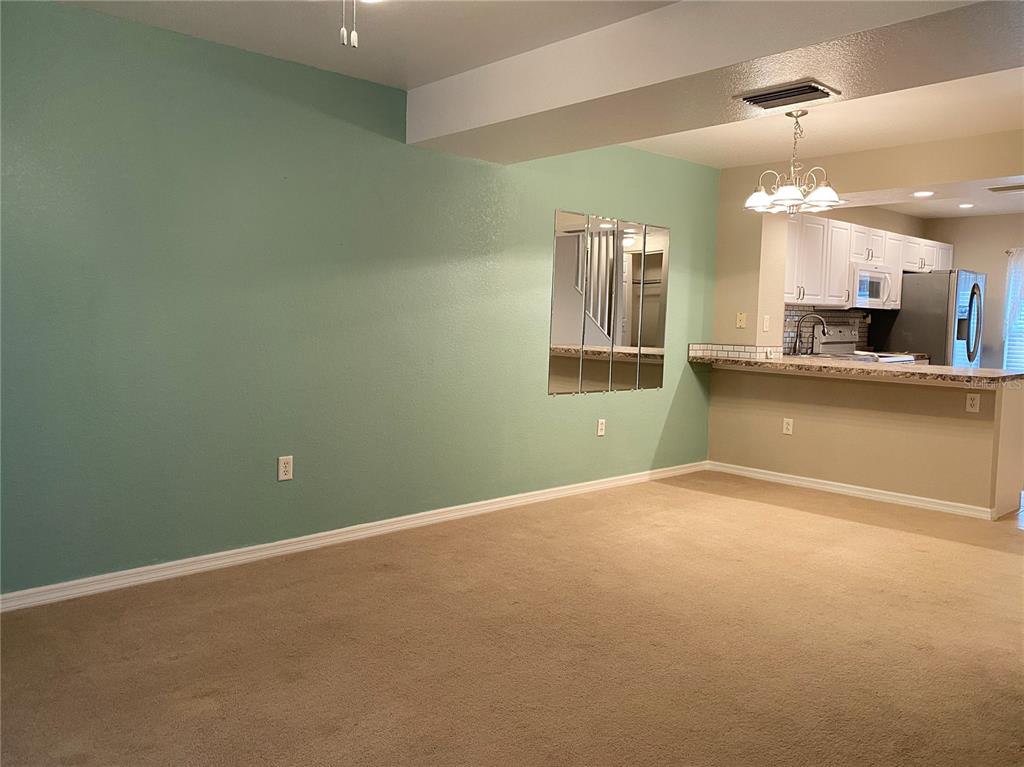 26346 Rampart Boulevard, Unit 904 Punta Gorda, FL 33983 - Photo 33 of 35 a view of a kitchen with a sink and a kitchen counter top space