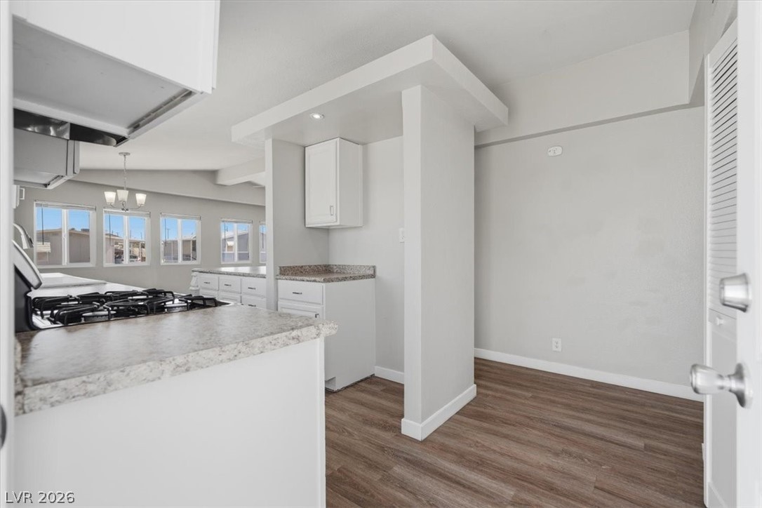 283 Aztec Lane Henderson, NV 89015 - Photo 4 of 21 A well-appointed kitchen boasts sleek countertops and a convenient built-in range.