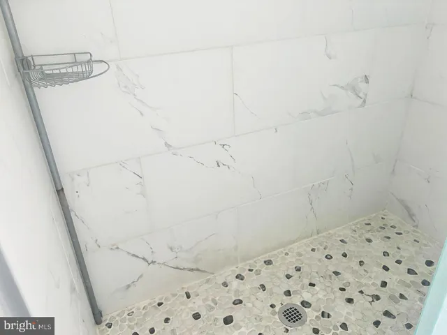 a bathroom with a sink toilet and window