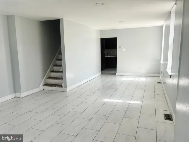 a kitchen with granite countertop stainless steel appliances a stove a microwave a sink and cabinets