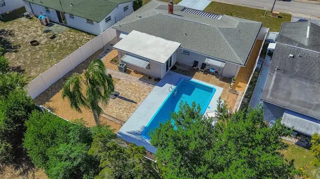 aerial view of a house with a yard