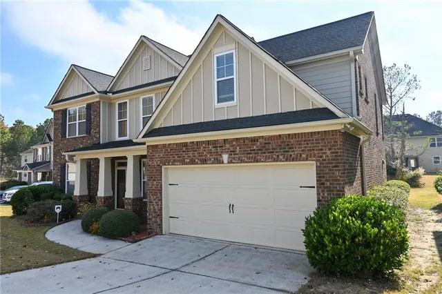 a kitchen with stainless steel appliances granite countertop a refrigerator a stove a sink and a microwave