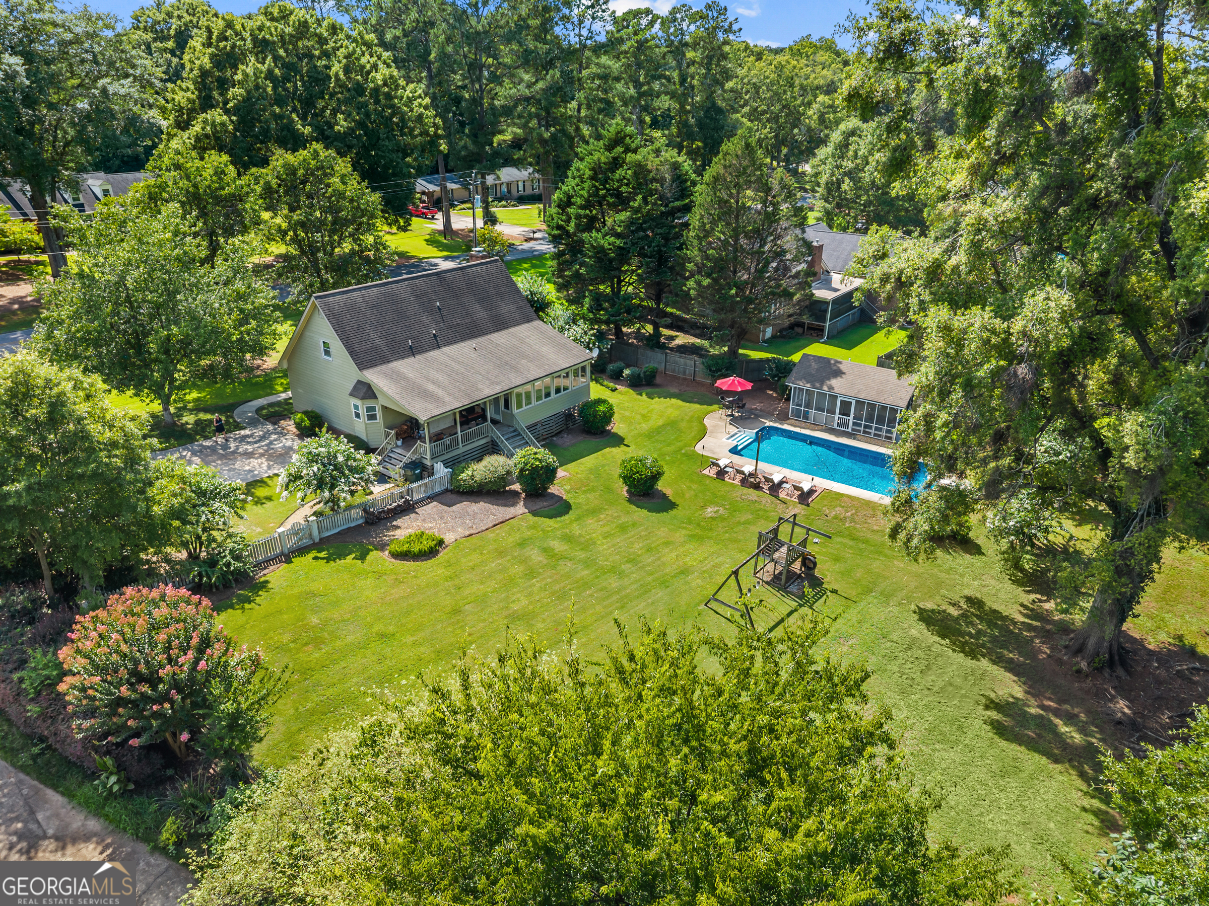 991 Crawford Street Madison, GA 30650 - Photo 19 of 25 an aerial view of house with yard swimming pool and outdoor seating