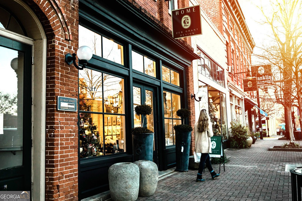 991 Crawford Street Madison, GA 30650 - Photo 24 of 25 a view of living room filled with furniture and floor to ceiling window