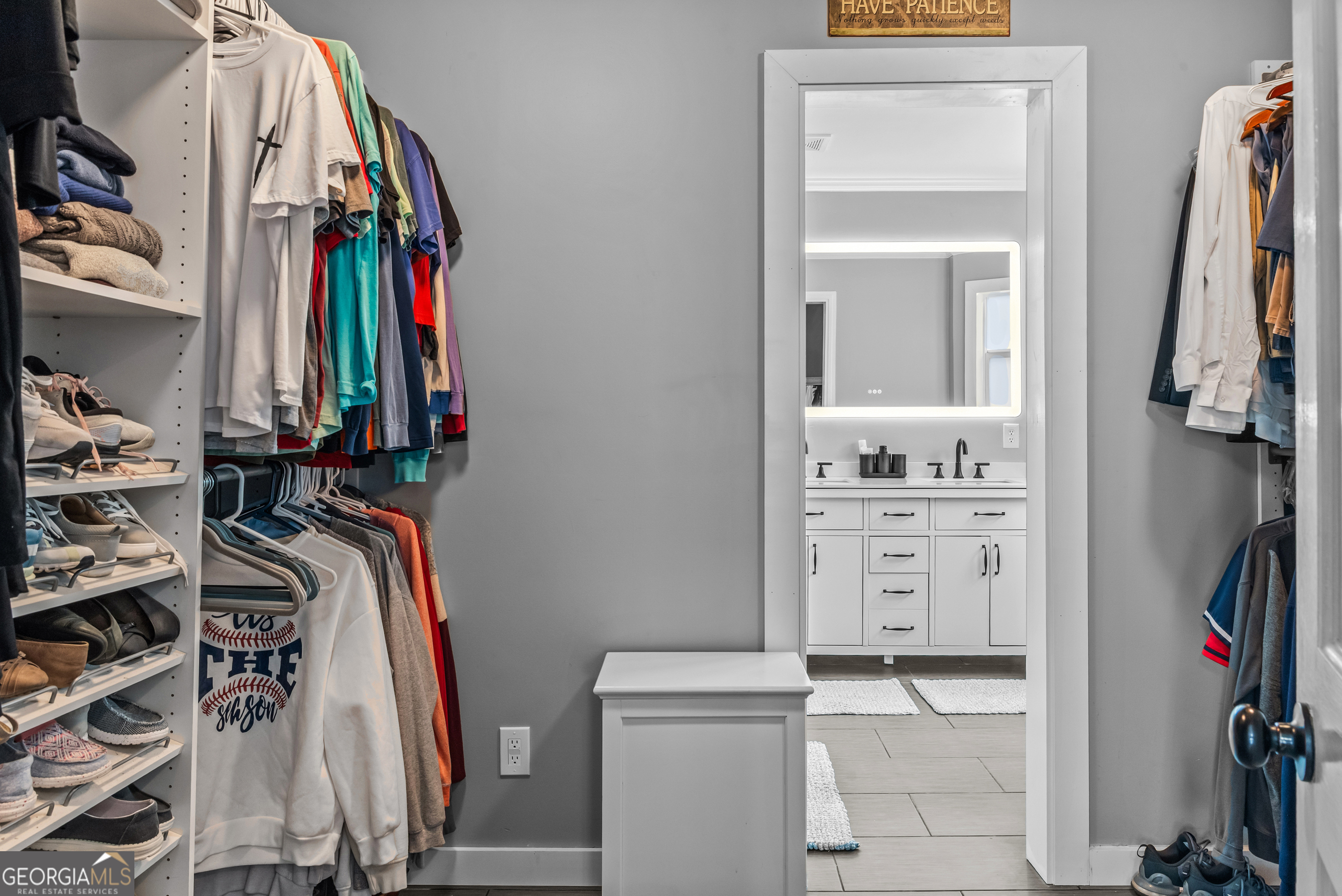 991 Crawford Street Madison, GA 30650 - Photo 10 of 25 a view of walk in closet with clothes and shoes