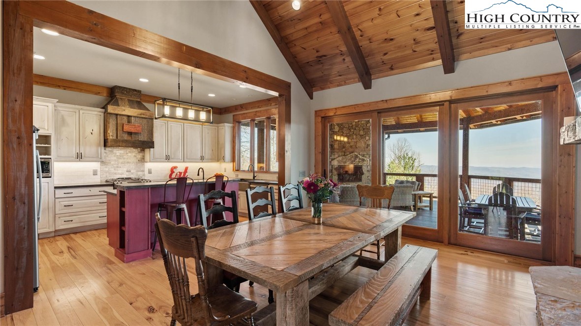137 Burningbush Trail Boone, NC 28607 - Photo 11 of 50 a view of a dining area with furniture window and wooden floor