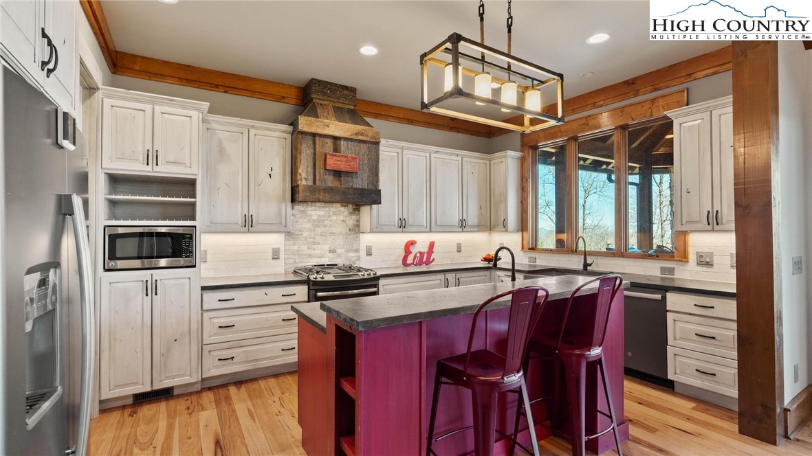 137 Burningbush Trail Boone, NC 28607 - Photo 12 of 50 a kitchen with stainless steel appliances a sink stove and refrigerator