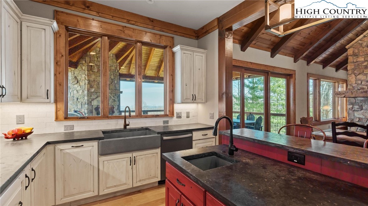 137 Burningbush Trail Boone, NC 28607 - Photo 14 of 50 a kitchen with a sink stove and cabinets