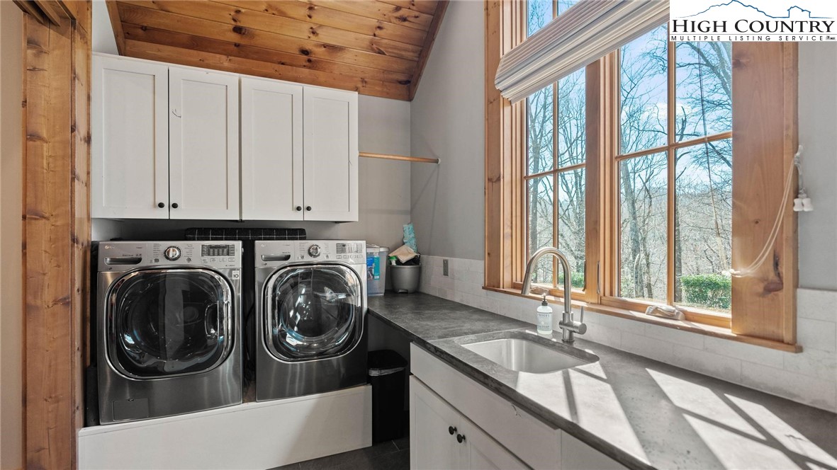 137 Burningbush Trail Boone, NC 28607 - Photo 17 of 50 a utility room with sink dryer and washer