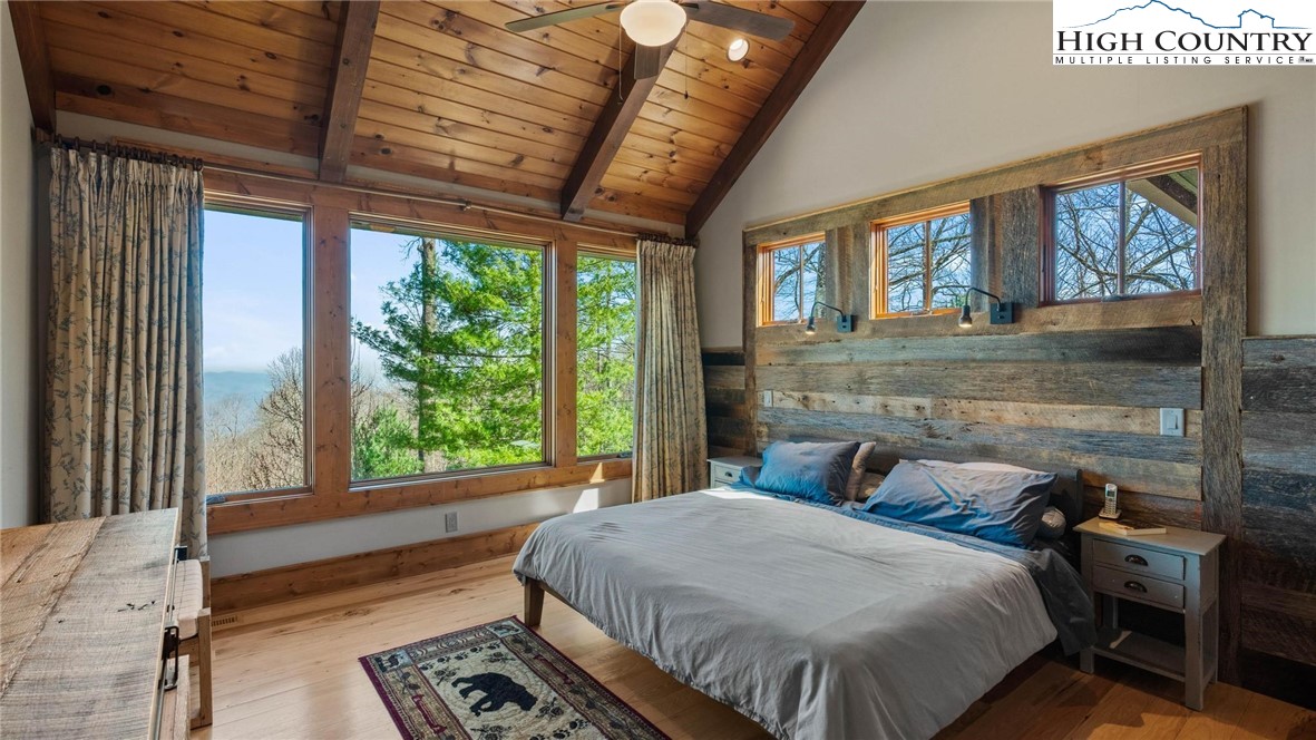 137 Burningbush Trail Boone, NC 28607 - Photo 18 of 50 a bed sitting in a bedroom next to a window