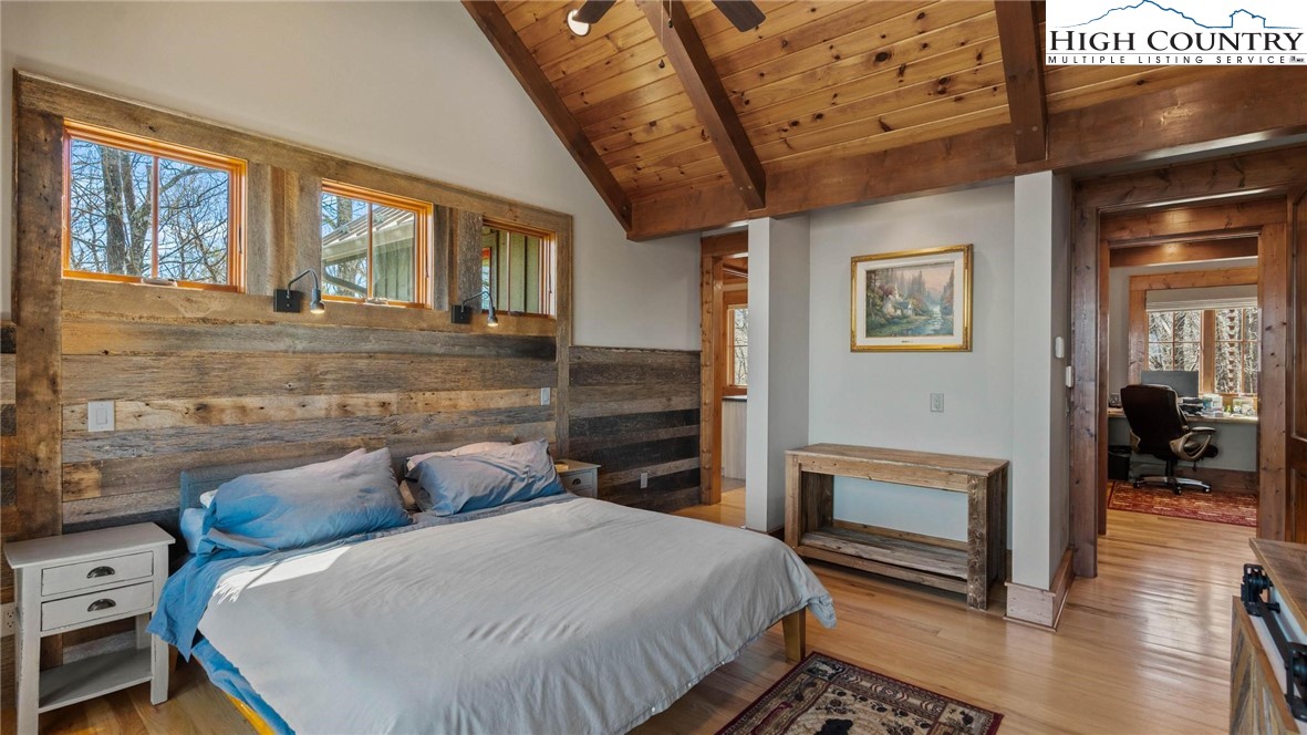 137 Burningbush Trail Boone, NC 28607 - Photo 19 of 50 a bedroom with furniture and a fireplace