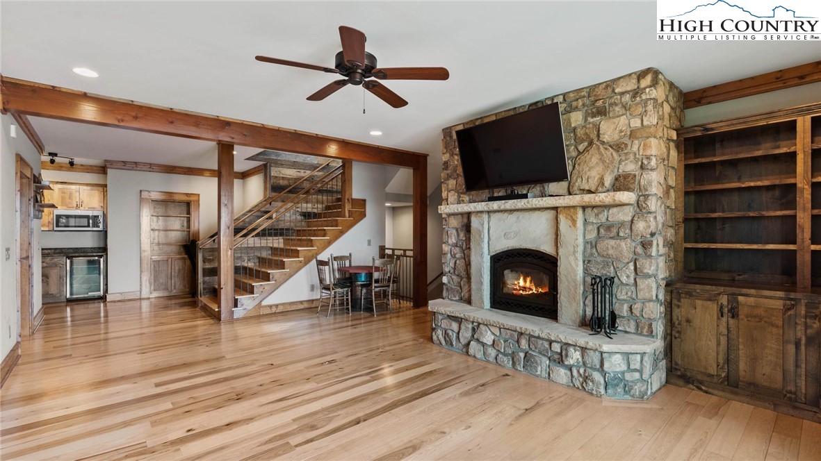 137 Burningbush Trail Boone, NC 28607 - Photo 24 of 50 a living room with furniture a flat screen tv and a fireplace