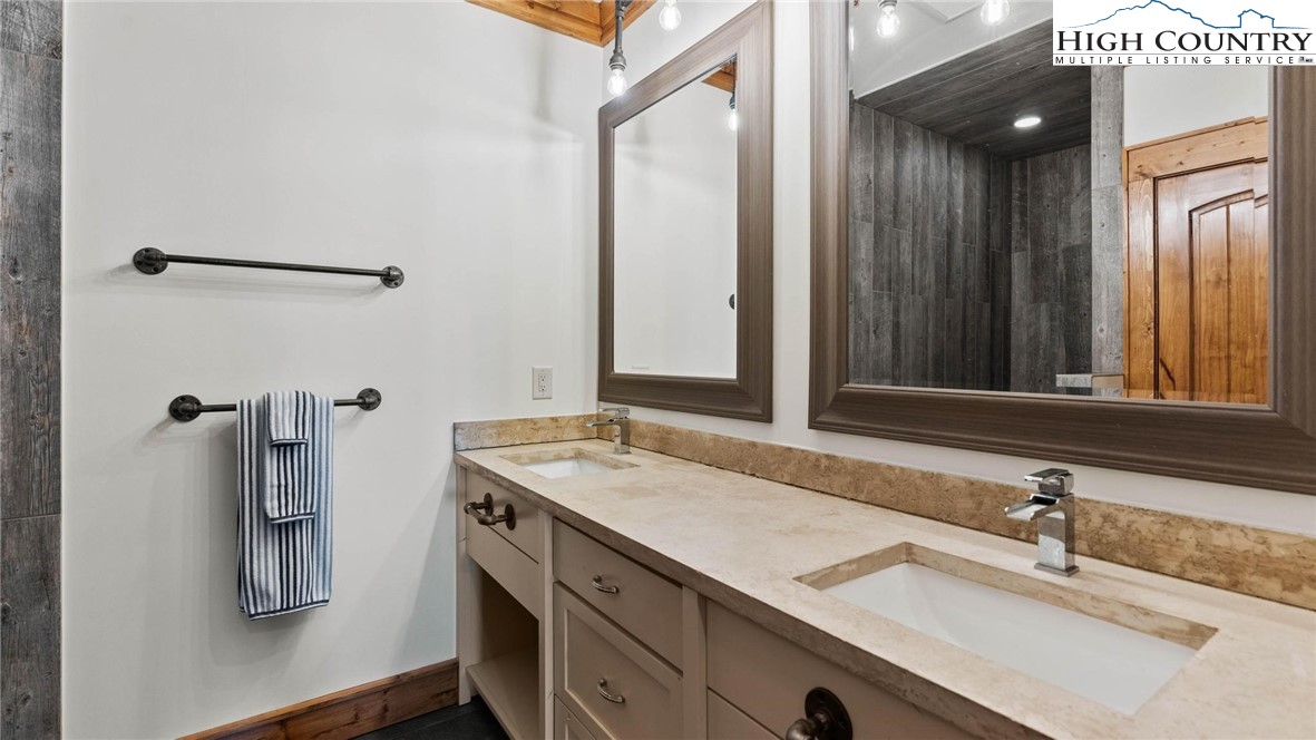 137 Burningbush Trail Boone, NC 28607 - Photo 31 of 50 a bathroom with a sink and mirror