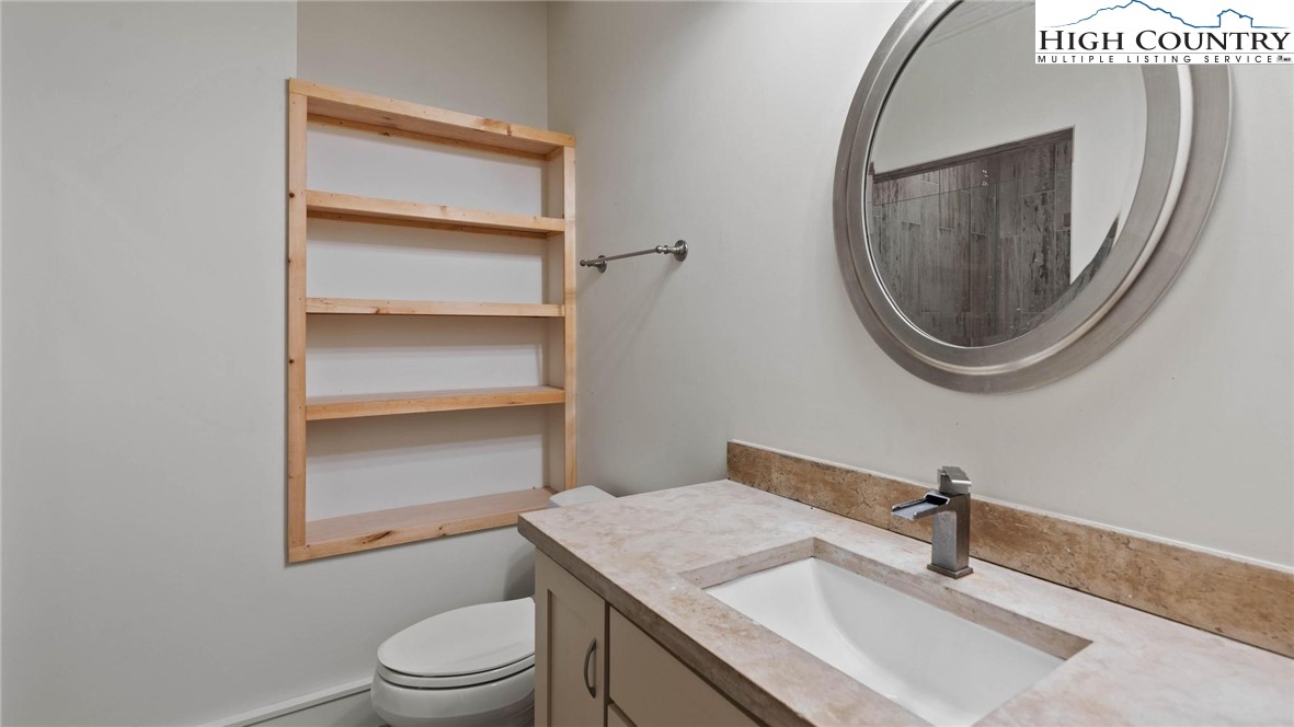137 Burningbush Trail Boone, NC 28607 - Photo 33 of 50 a bathroom with a sink toilet and mirror
