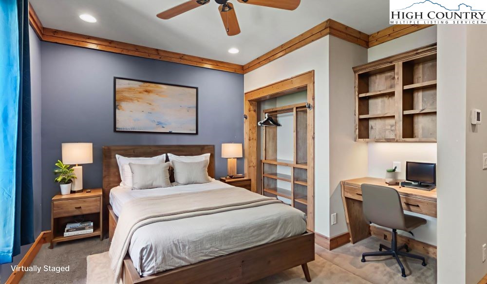 137 Burningbush Trail Boone, NC 28607 - Photo 35 of 50 a bedroom with a bed and a bookshelf