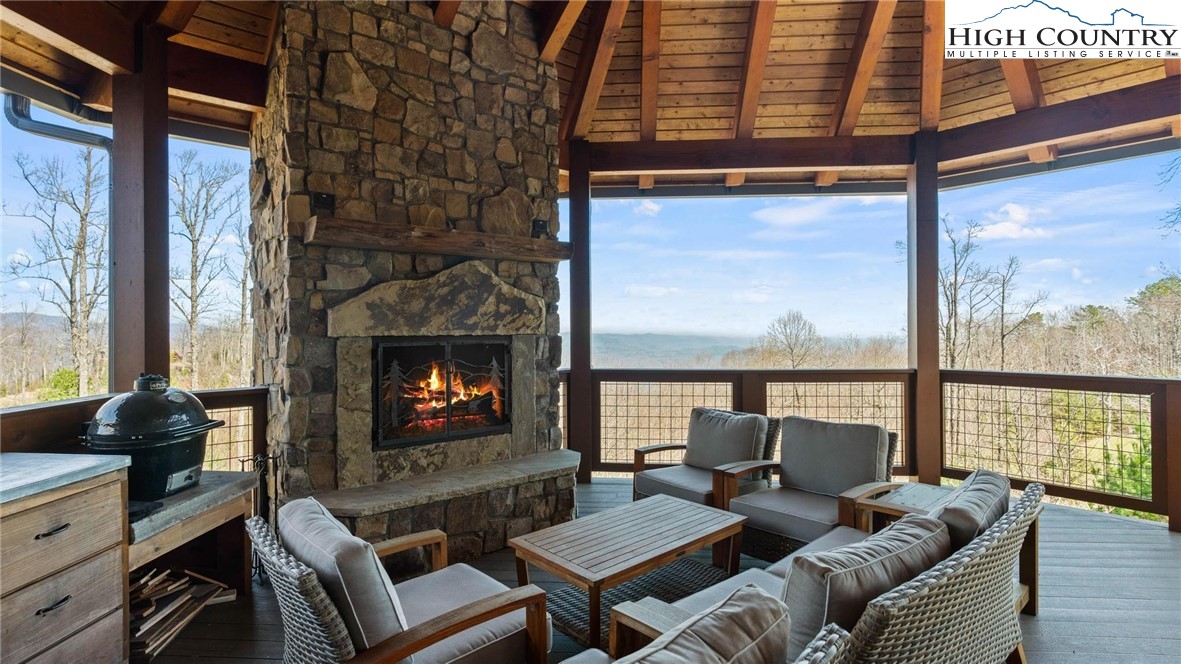 137 Burningbush Trail Boone, NC 28607 - Photo 41 of 50 a living room with fireplace furniture and a floor to ceiling window