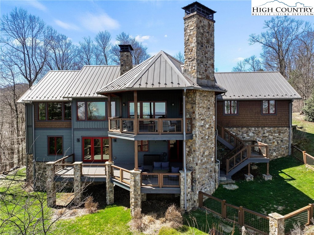 137 Burningbush Trail Boone, NC 28607 - Photo 45 of 50 a front view of a house with a garden