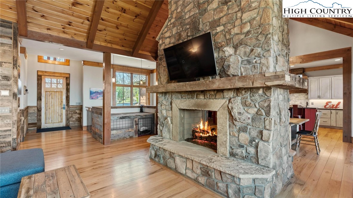 137 Burningbush Trail Boone, NC 28607 - Photo 8 of 50 a living room with furniture a flat screen tv and a fireplace