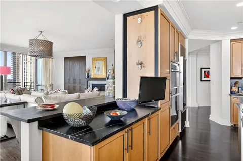 a kitchen with a sink stove and cabinets