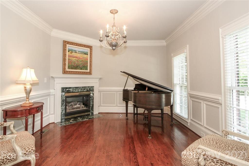 2125 South Wendover Road Charlotte, NC 28211 - Photo 11 of 48 a living room with furniture a fireplace and wooden floor