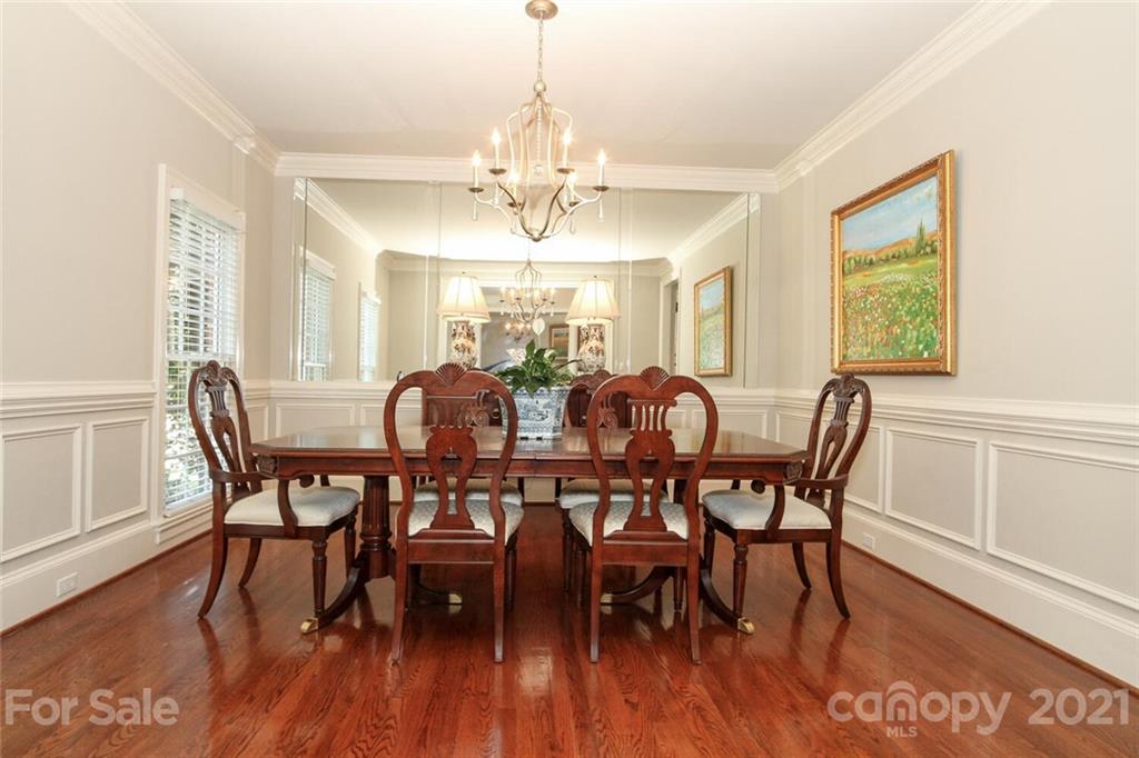 2125 South Wendover Road Charlotte, NC 28211 - Photo 12 of 48 a view of a dining room with furniture window and wooden floor