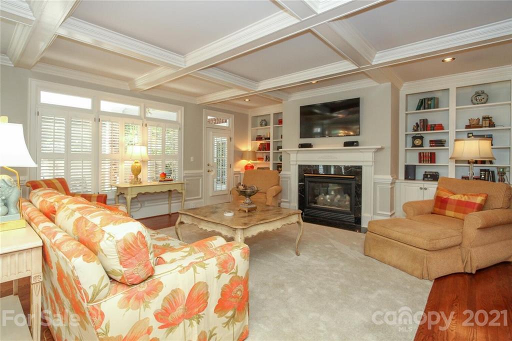 2125 South Wendover Road Charlotte, NC 28211 - Photo 13 of 48 a living room with furniture a flat screen tv and a fireplace