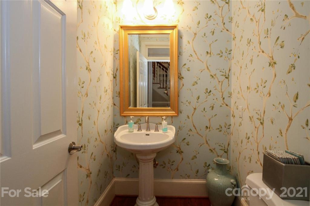 2125 South Wendover Road Charlotte, NC 28211 - Photo 21 of 48 a bathroom with a sink and mirror