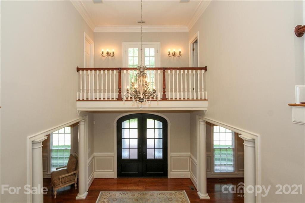 2125 South Wendover Road Charlotte, NC 28211 - Photo 27 of 48 a view of a hallway with wooden floor and staircase