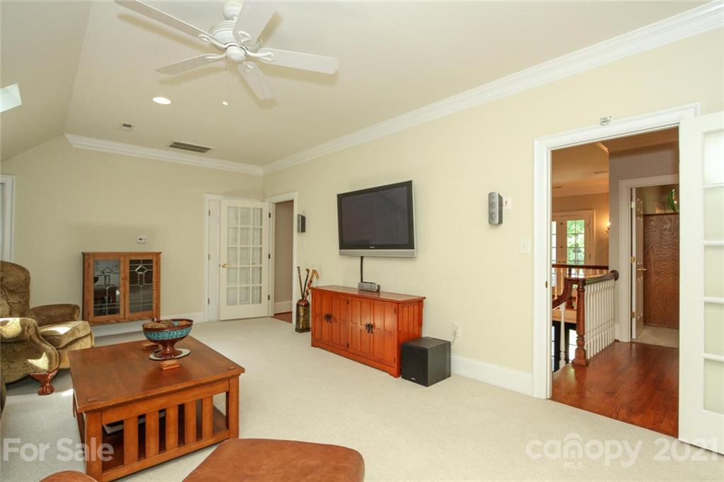2125 South Wendover Road Charlotte, NC 28211 - Photo 30 of 48 a living room with furniture and a flat screen tv