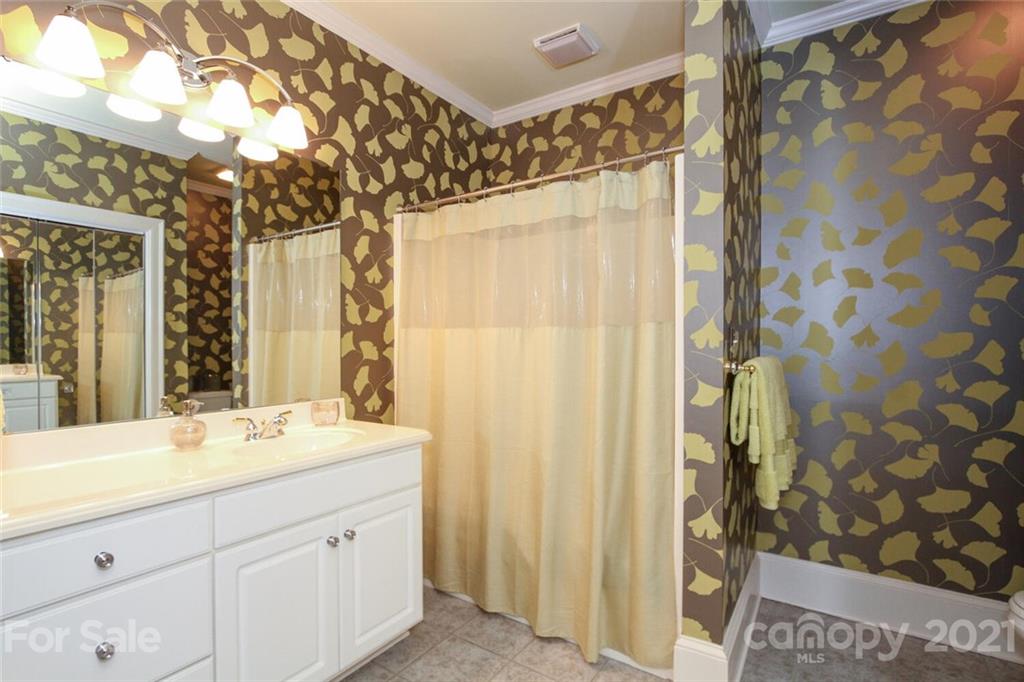 2125 South Wendover Road Charlotte, NC 28211 - Photo 32 of 48 a bathroom with a double vanity sink and a mirror