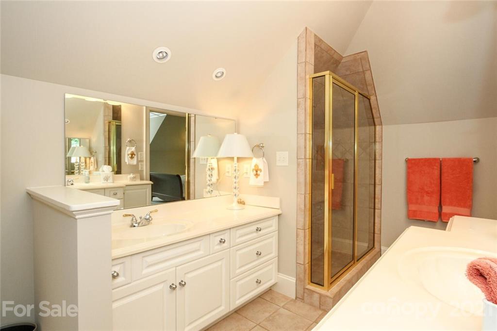 2125 South Wendover Road Charlotte, NC 28211 - Photo 34 of 48 a bathroom with a sink and a mirror