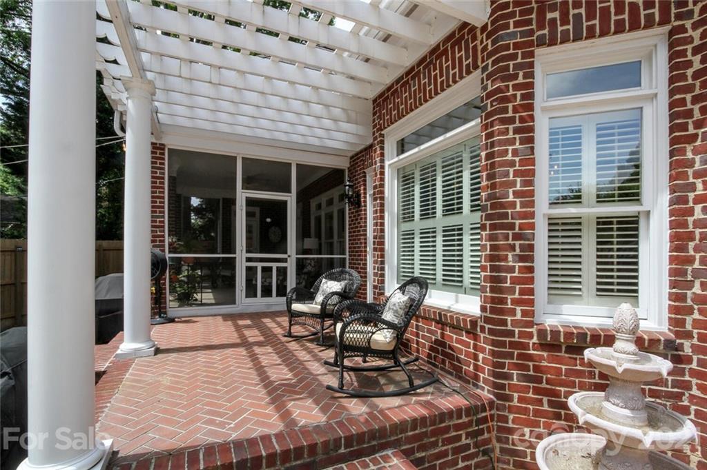 2125 South Wendover Road Charlotte, NC 28211 - Photo 44 of 48 a view of a patio with a table and chairs