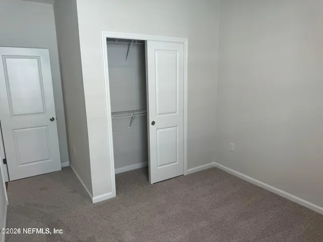 an empty room with closet