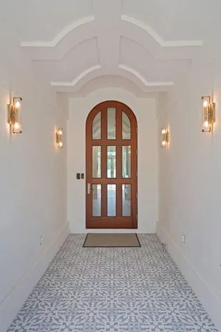 a large kitchen with kitchen island a large island a sink stainless steel appliances and cabinets