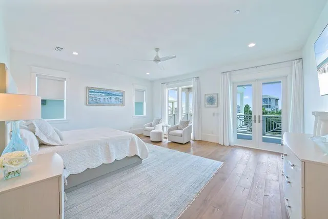 a bedroom with a bed a couch and a window