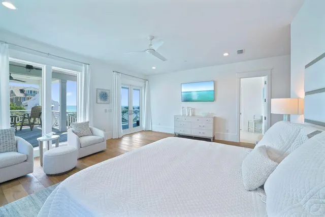 a bedroom with a large bed and a window