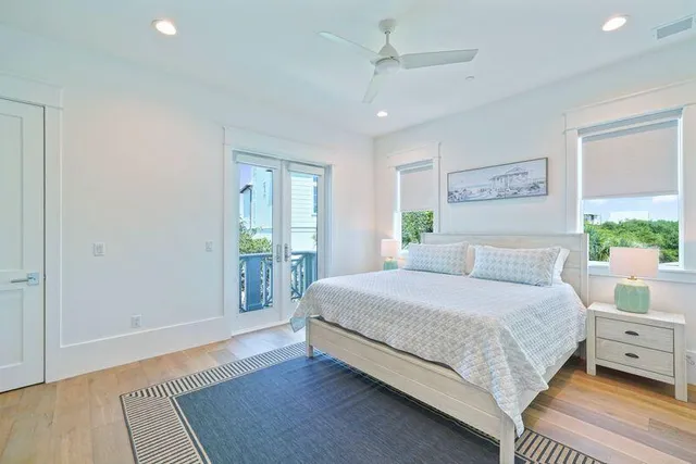 a spacious bathroom with a granite countertop sink a mirror a vanity and a shower