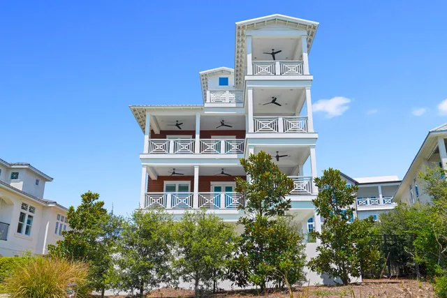 a view of a balcony with furniture and wooden floor