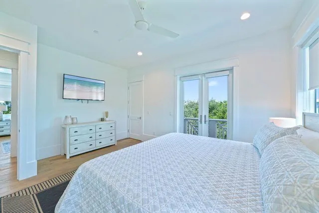 a spacious bedroom with a large bed and a couch