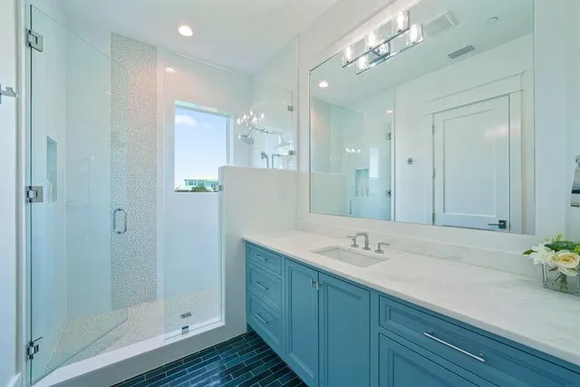 a spacious bedroom with a bed and a couch